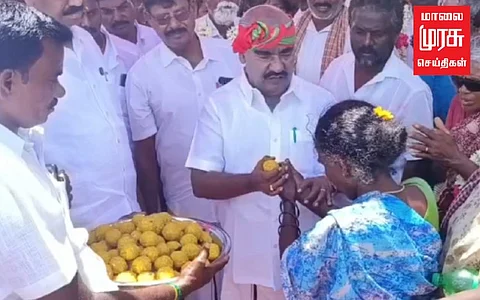 சாமியாடி சாலை வசதி கேட்ட பெண்... லட்டு கொடுத்து பதிலளித்த அமைச்சர்!!