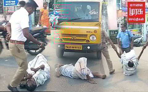 சாலையில் படுத்து உருண்ட முதியவர்...செய்வதறியாது நின்ற போலீசார்...சிக்கி தவித்த வாகன ஓட்டிகள்!