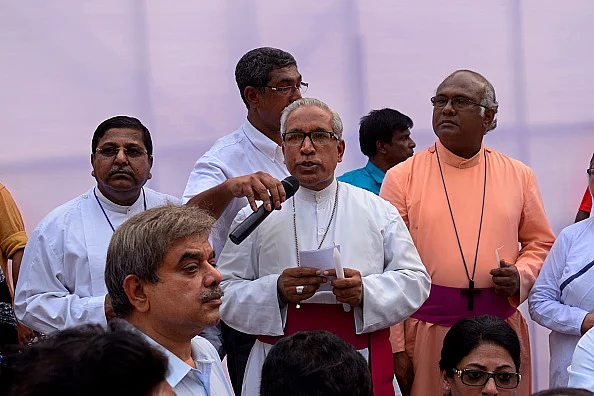 Father organising protests against nun rapes/Getty Images 