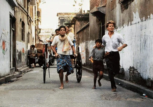 CITY OF JOY, from centre: Om Puri, Imran Badsah Khan, Patrick Swayze, 1992 (©Tri-Star Pictures)