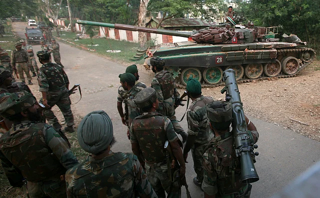File photo of an Indian army tank, moving past soldiers during a search operation. (Photo: Reuters)