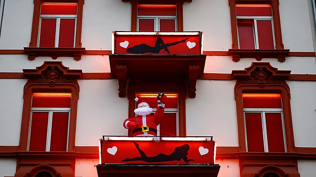 A huge inflatable Father Christmas figure is seen in the balcony of a brothel in the red-light district of Frankfurt. (Photo: Reuters)