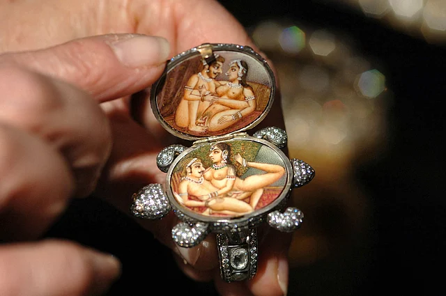The director of the Diamond Information Center, Sally Morrison, shows the inside of a tortoise ring decorated with kamasutra artwork (Photo: Reuters)