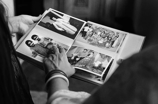 One of Smita Sharma’s aunts shows the family album to her friend Allison Joyce. These family members have migrated from Bangladesh and settled in different countries. (Photo: Smita Sharma)