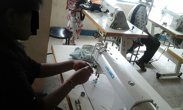 This woman is one of the many grateful beneficiaires who are proudly earning a living at ToF. (Photo Courtesy: Threads of Freedom)