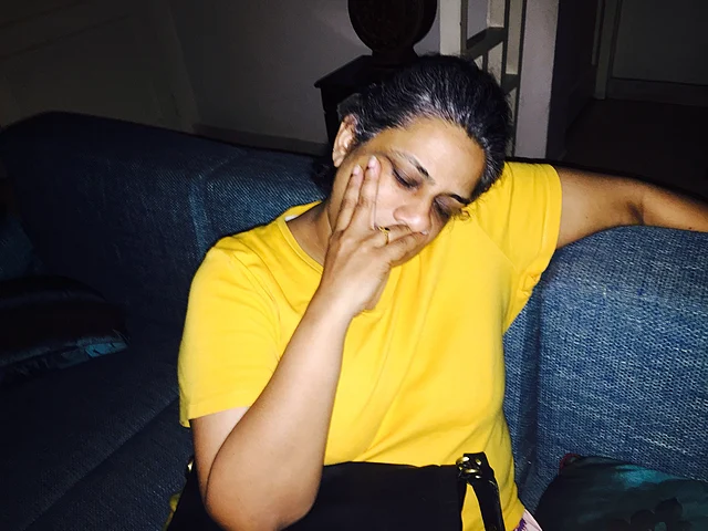 This photo was taken by a friend when the author, completely exhausted, fell asleep in the middle of a conversation. (Photo Courtesy: Sangeeta Murthi Sahgal)