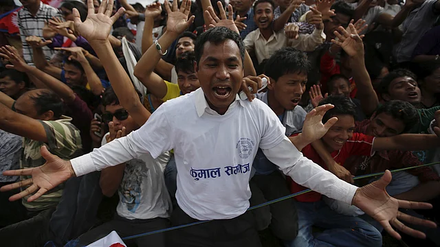 September 21: People cheer as they gather during a celebration, a day after the first democratic Constitution was announced in Kathmandu. (Photo: Reuters)