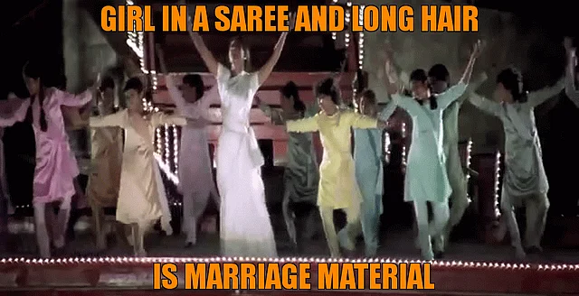 Shah Rukh finally falls for Kajol when she turns into a long haired sari clad demure beauty (Source: <a href="https://www.youtube.com/watch?v=O6lQD9YXnbU&feature=youtu.be">YouTube/ Khan HD Music 1080p</a>)