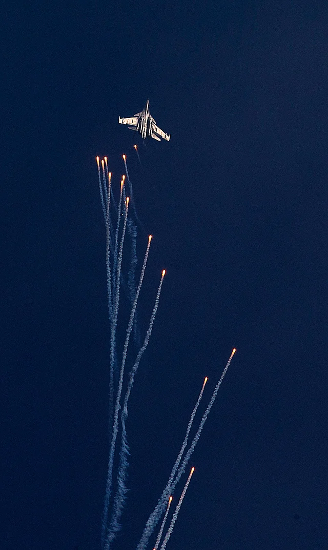 Indian Air Force Sukhoi Su-30 MKI fires flares during a Vertical Charlie manoeuvre at the Air Force Day parade at Hindon Air Force base. (Photo: AP)