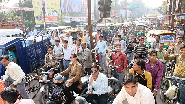 Motorists and cyclists wait patiently in a traffic jam in Delhi. The modes of transport include bicycles, motorbikes, mopeds, vans, cars and rickshaws. (Photo: iStock)