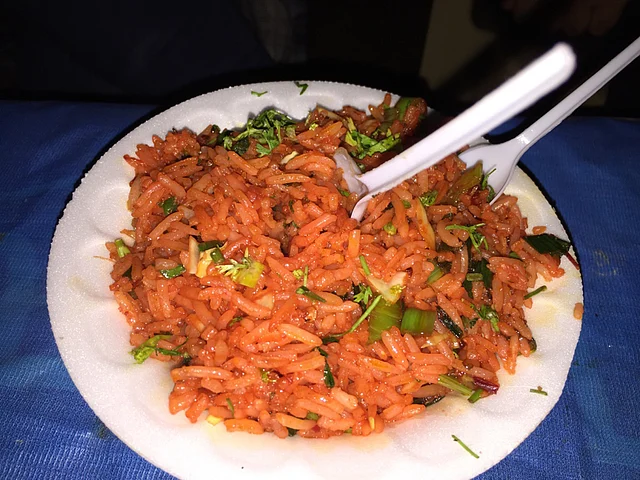 We were served a healthy helping of delicious Schezwan rice, cooked over a bonfire. (Photo Courtesy: Radhika Sharma)