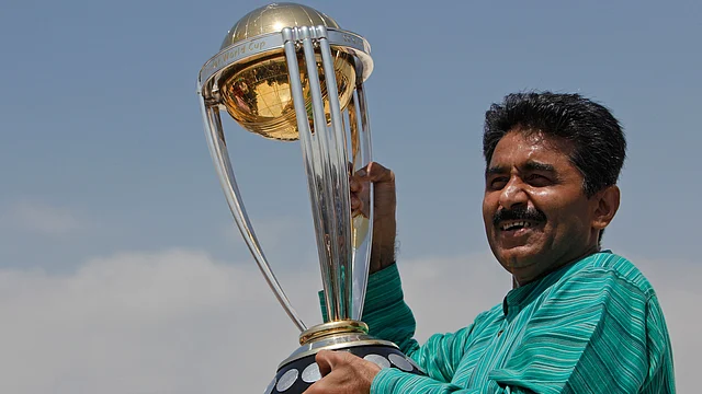 Former Pakistani cricketer Javed Miandad with the World Cup trophy. 