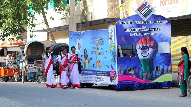 An Election Commission campaign vehicle urges the voters to exercise their voting rights at Balurghat in South Dinajpur district of West Bengal on April 8, 2016. (Photo: IANS)