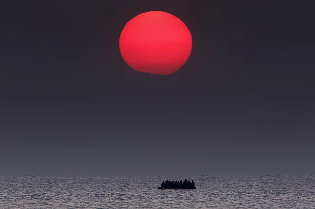 An overcrowded inflatable boat with Syrian refugees drifts in the Aegean sea between Turkey and Greece after its motor broke down off the Greek island of Kos, 11 August 2015. <i>Reuters</i> and <i>The New York Times</i> shared the<i> Pulitzer Prize</i> for breaking news photography for images of the migrant crisis in Europe and the Middle East. (Photo: Reuters/Yannis Behrakis)