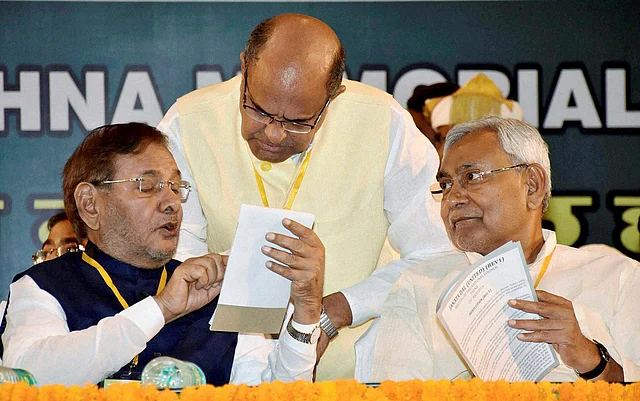 Bihar Chief Minister and newly elected JD(U) President Nitish Kumar and senior party leaders Sharad Yadav and KC Tyagi at the party’s National Council Meeting. (Photo : PTI)