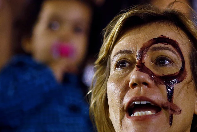 A woman attends a protest against rape and violence against women in Rio de Janeiro. (Photo: Reuters)