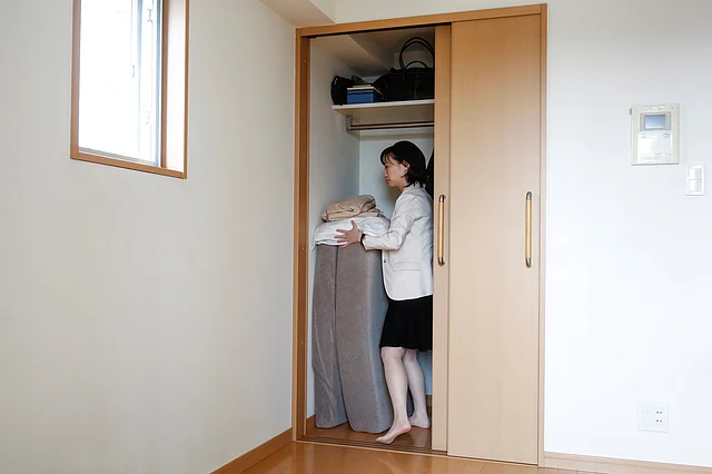 Minimalist Saeko Kushibiki stores away her futon mattress in her apartment in Fujisawa, south of Tokyo. (Photo: Reuters)