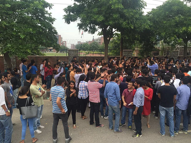 Students celebrate as two faculty members resigned on Friday. (Photo Courtesy: Twitter/ <a href="https://twitter.com/secondofhername">Secondofhername)</a>
