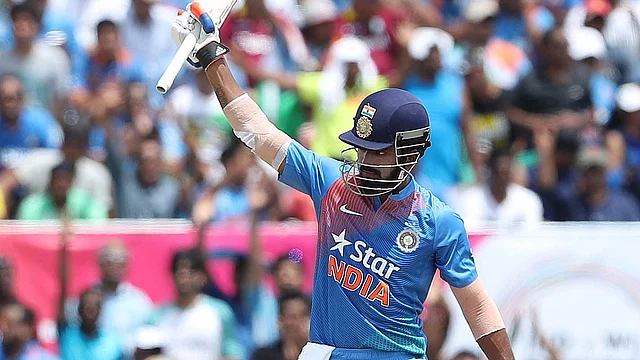 KL Rahul raises his bat after scoring his maiden T20 ton. (Photo: PTI)