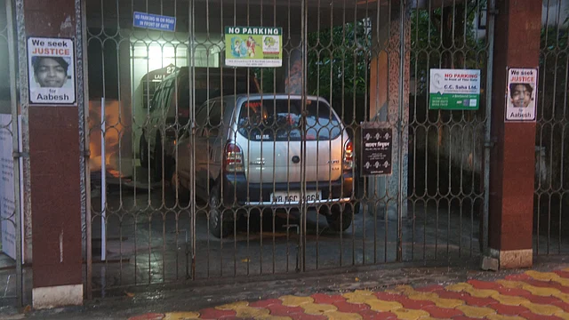 Posters demanding justice for Aabesh outside the building where the family lives. Aabesh’s mother claims her son was murdered. (Photo: Sujoy Dhar/ <b>The Quint</b>)