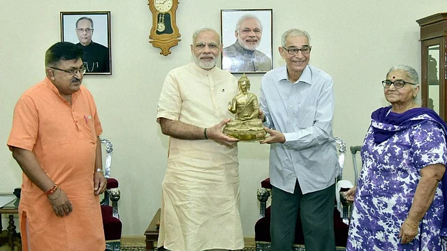 Prime Minister Narendra Modi being greeted by Governor of Gujarat O P Kohli on his birthday in Gandhinagar, 17 September, 2016. (Photo: PTI)
