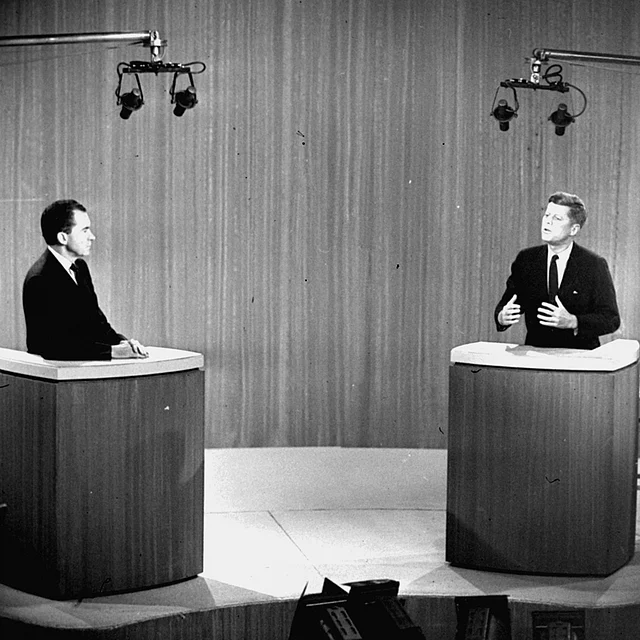 John F Kennedy and Richard M Nixon listens on 21 October 1960. (Photo: AP)