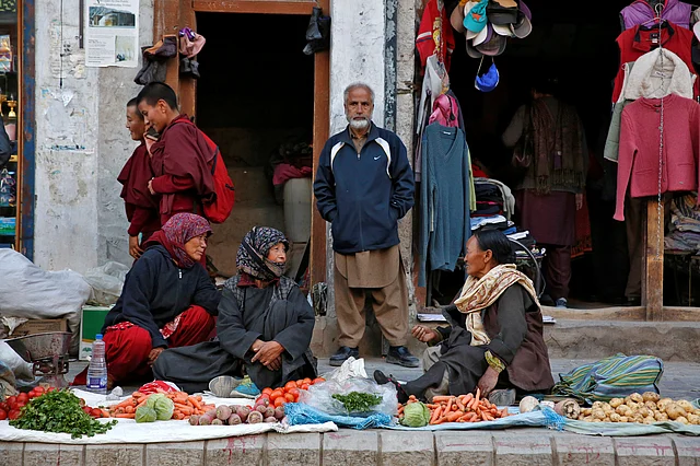 Vegetable vendors chat in Leh, the largest town in the region of Ladakh, nestled high in the Indian Himalayas. (Photo: Cathal McNaughton)