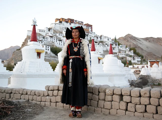 Phunchok Angmo, 33, a mathematics teacher, poses for a photograph at Thiksey monastery, near Leh, the largest town in the region of Ladakh. (Photo: Cathal McNaughton)