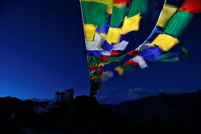 Prayer flags stretch towards Tsemo Monastery in the city of Leh, the largest town in the region of Ladakh. (Photo: Cathal McNoughton)
