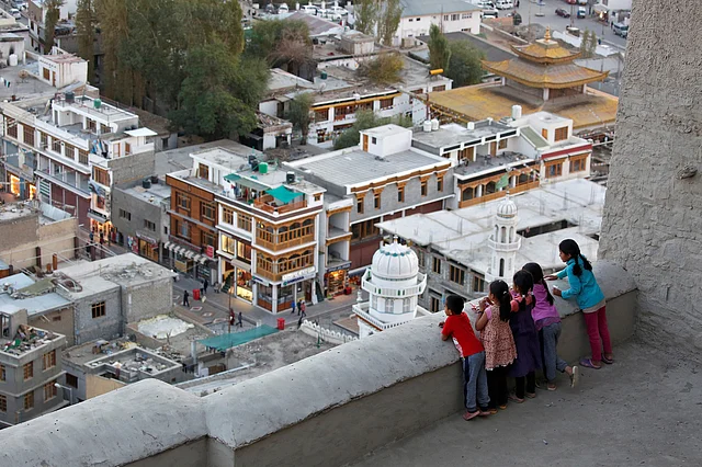 Children look down from the Royal Palace in Leh, the largest town in the region of Ladakh, nestled high in the Indian Himalayas. (Photo: Cathal McNaughton)