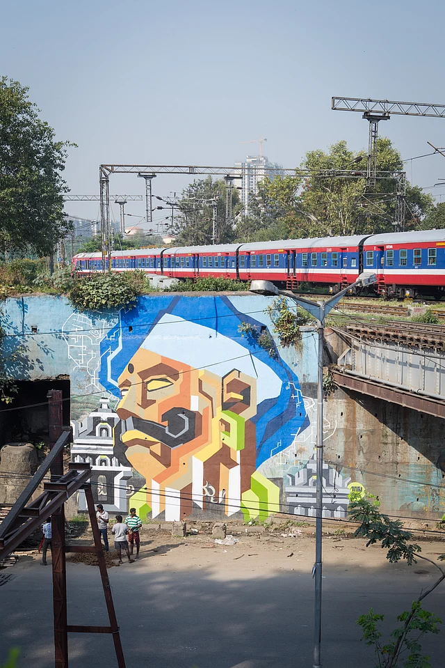 Artist Ullas Hydoor has recreated an old map of Bengaluru with city’s founder Kempegowda’s face on it. “It is about where we were and where we are headed to”, says Ullas Hydoor. The artwork is close to a bridge, which means every time a train passes by, people engage with his work. (Photo Courtesy: <a href="http://www.st-artindia.org/blr-2016">St-art Foundation</a>)