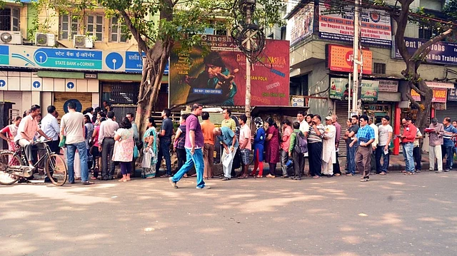 People wait outside banks to exchange currency notes in Kolkata on 10 November, 2016. (Photo: IANS)