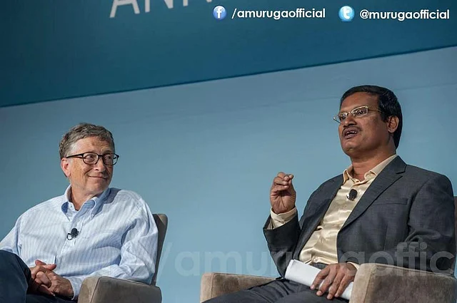 Bill Gates listens to Arunachalam speak at the ‘Grand Challenges’ Annual Meeting in Seattle. (Photo courtesy: Facebook)