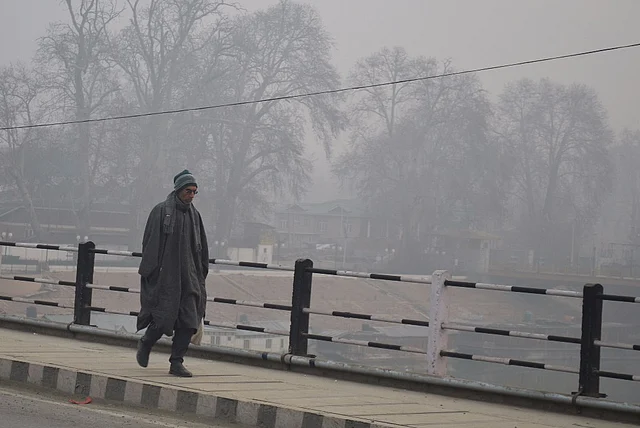 A man walks on Abullah Bridge in Srinagar on New Year morning.