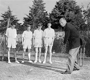 Cariappa tries his hand at cricket with Australian boys. 
