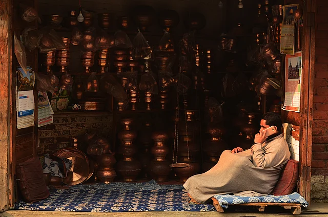 A bronzeware shop in downtown Srinagar. Delicately carved bronzeware is traditionally used in Kashmiri kitchens.
