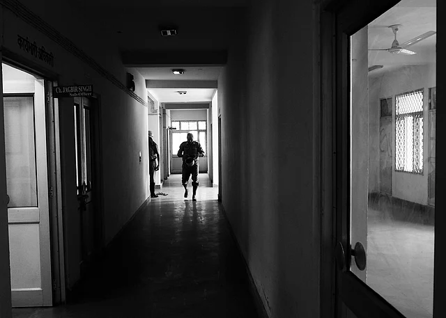 A fireman getting ready while running towards his firetruck right after the call. (Photo courtesy: Sameer Khan)
