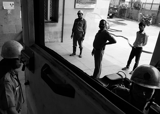 Firemen getting ready to board on the truck. After getting a call, they have to respond within
a minute, during the day. (Photo courtesy: Sameer Khan) 