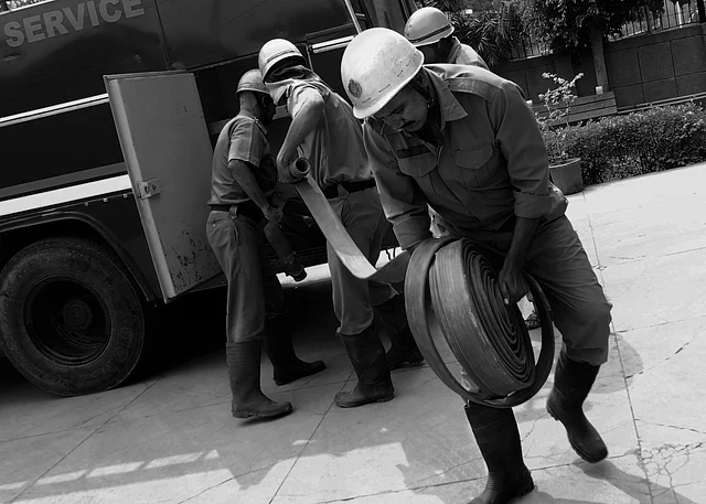 Firemen taking out the fire pipe at the fire location. (Photo courtesy: Sameer Khan) 