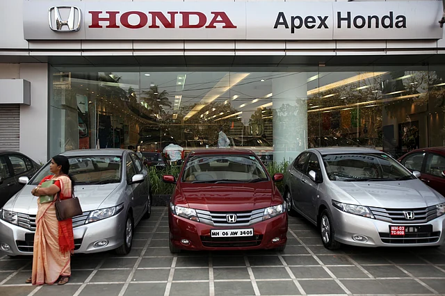 Buyers of cars and bikes in India will bear the cost of the switch. (Photo: BloombergQuint)