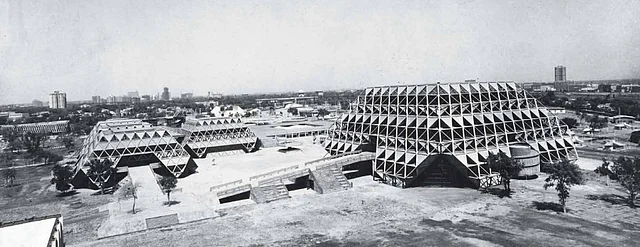 Aerial view of the exhibition hall complex with the larger Hall of Nations and four smaller Halls of Industries built for the 1972 International Trade Fair. (Photo: Copyright Mahendra Raj Archive via <a href="https://architexturez.net/doc/az-cf-123722">Architexturez.net</a>)