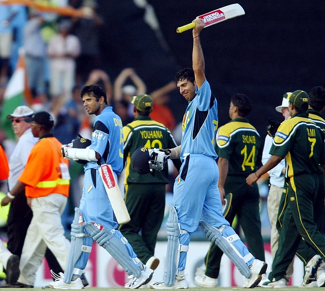 Rahul Dravid and Yuvraj Singh celebrate the team’s 6-wicket victory. (Photo: Reuters)
