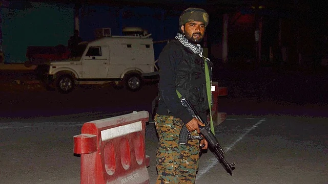 A police official in the aftermath of the Anantnag attack. 