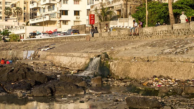 Dirty water pouring from a drain in Mumbai.