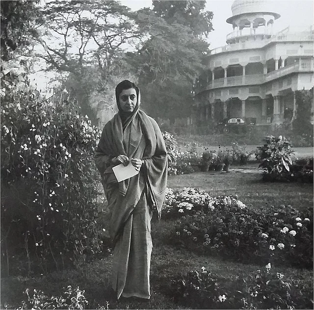 1959: Indira Gandhi standing in the lawns of Anand Bhavan in Allahabad. A symbolic photograph where her childhood home stands in the background with her ancestral legacy.