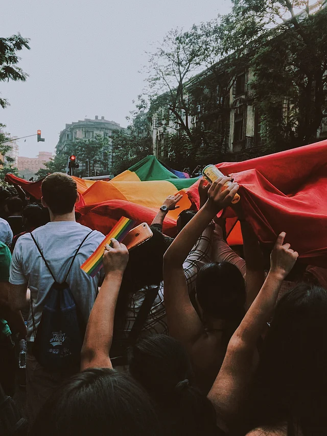 People carry the giant LGBTQI rainbow flag at the Mumbai Pride Parade 2018. 