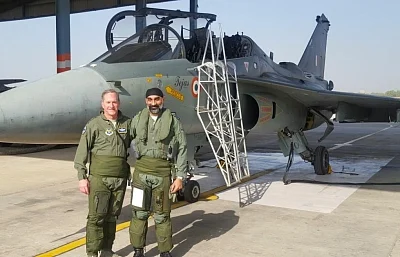 Jodhpur: Chief of US Air Force, General David L. Goldfein with Air Vice Marshal A.P. Singh at the IAF station in Jodhpur on Feb 3, 2018. The Chief of US Air Force, General David L. Goldfein, flew a sortie in the indigenous Light Combat Aircraft Tejas on Saturday. The indigenous LCA is a single-seat, single-jet engine, multirole light fighter. Goldfein arrived in India on Thursday, on a visit to boost defence ties between the two nations. (Photo: IANS/DPRO)
