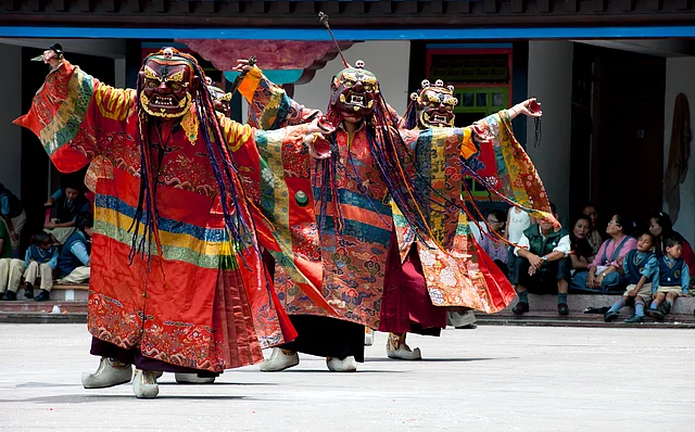Tibetan Buddhist monks wearing traditional masks during an annual religious ceremony in Rumtek Monastery (Kagyu order) near Gangtok.