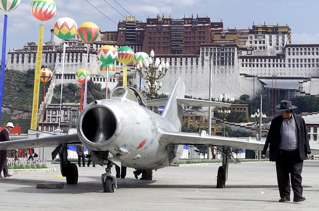 A 1950s Chinese fighter jet displayed at a square in front of Potala Palace in Lhasa - a seemingly symbolic representation of the presence of Chinese military. 