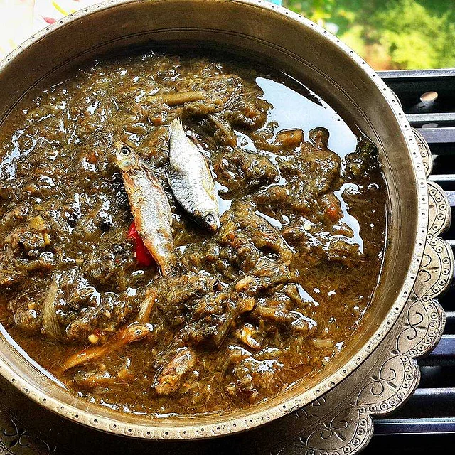 Kosuthuri Hukoti Maas (tender Colocasia leaves) cooked with smoked pond fishes.